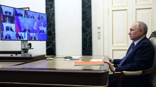 Vladimir Putin chairs a Security Council meeting via a video link at the Kremlin in Moscow