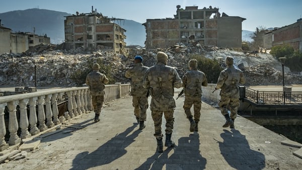 Turkish soldiers patrol Antakya city destroyed by the earthquake, where some buildings were raided by looters in the aftermath