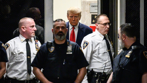 Former US President Donald Trump arrives at the courtroom in Manhattan Criminal Court