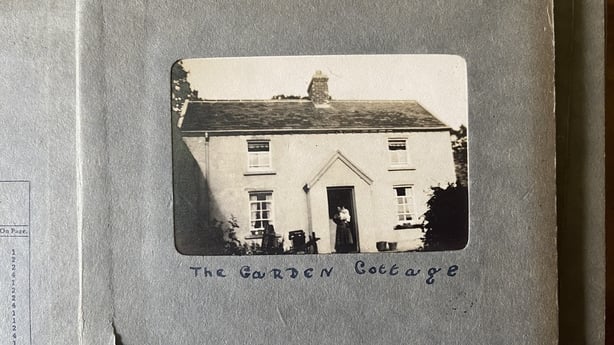 A black and white photo of a cottage