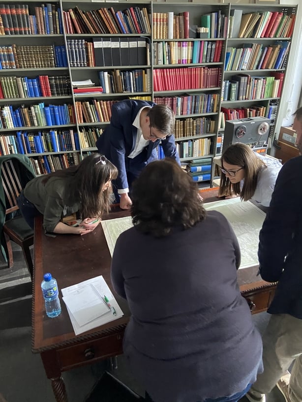 A group of people gathered around a table