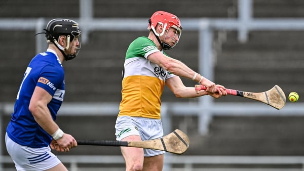 Eoghan Cahill shoots to score Offaly's first goal, under pressure from Liam O'Connell