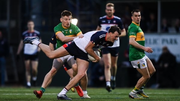 New York's Gavin O'Brien tries to break clear of Leitrim's Shane Quinn