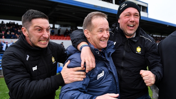 Colm Collins celebrates with coaches Micheál Cahill (L) and Joe Hayes (R)
