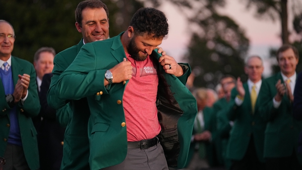 Jon Rahm slips on the green jacket at Augusta