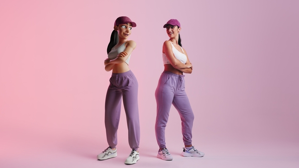 Happy young woman standing next to her metaverse avatar