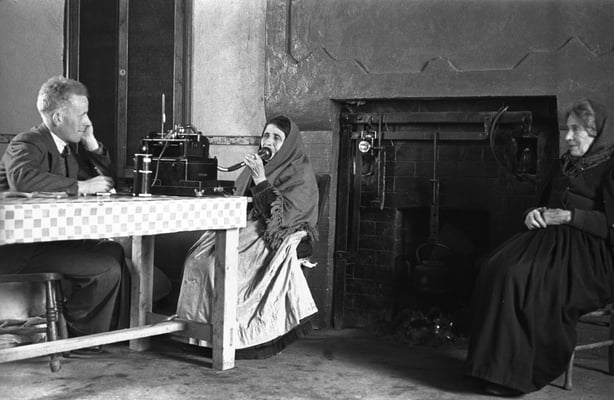 Irish Folklore Commission collector, Seosamh Ó Dálaigh, recording from sisters Cáit and Máire Ruiséal, Dunquin, Co. Kerry, 1942. (National Folklore Collection UCD)