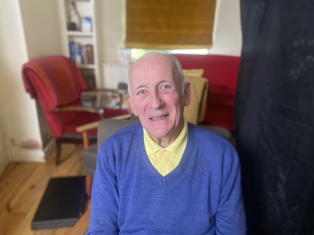 Frank Aiken Jr, a colour photo of an older white man in a blue jumper