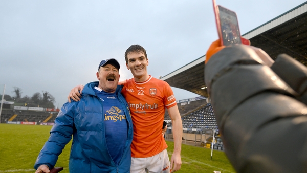 Armagh's Jarly Óg Burns poses for a photograph with Cavan supporter Pat McCoy