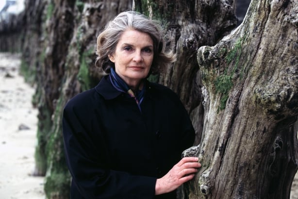 Colour photo of Julia O'Faolain, a white middle aged woman with grey waved bobbed hair