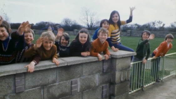 Children waving in the village of Kilmuckridge in County Wexford, 1978