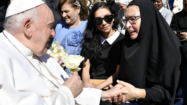 Pope Francis greets a woman in St Peter's Square yesterday during his weekly general audience
