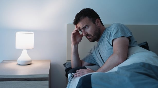 Man having trouble sleeping at night