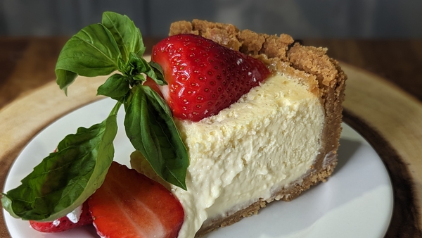 This luscious baked cheesecake is made even more delicious by the addition of marinated strawberries.