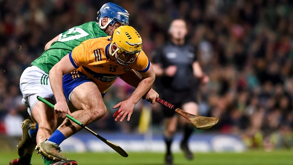 Mark Rodgers of Clare tangles with Limerick's Ciaran Barry during February's league clash