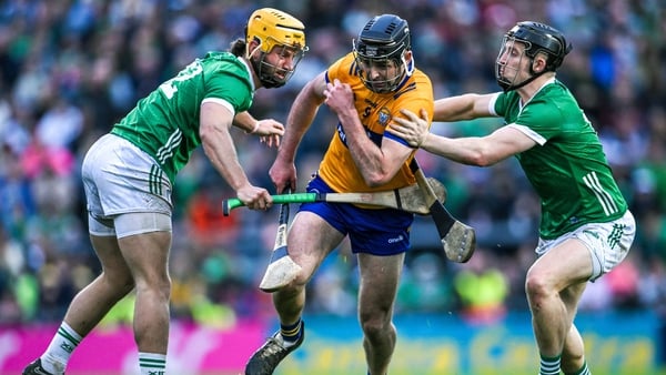 Cathal Malone of Clare in action against Tom Morrissey, left, and Peter Casey of Limerick