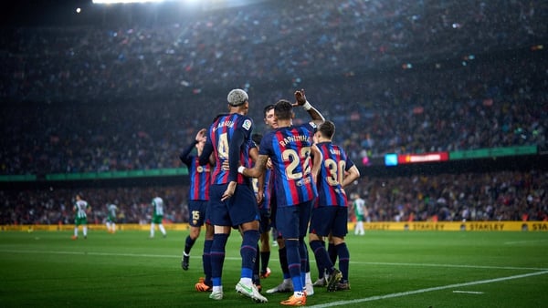 Robert Lewandowski celebrates with team-mates following his goal in Barcelona's victory