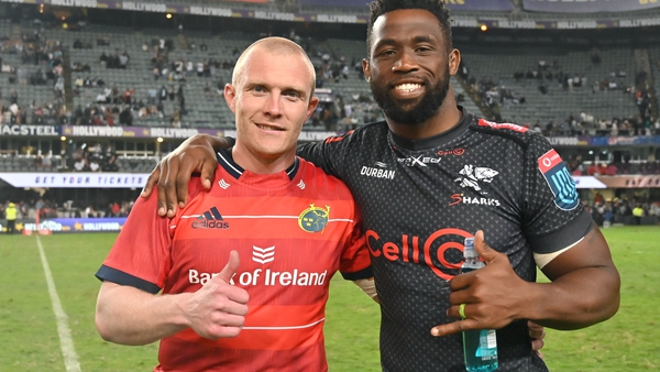 Siya Kolisi (r) pictured with Munster's Keith Earls following their recent URC meeting