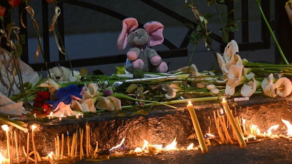 Flowers and candles at a makeshift memorial for the victims following the shooting at a school in the Serbian capital Belgrade