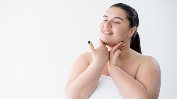 woman applying moisturiser