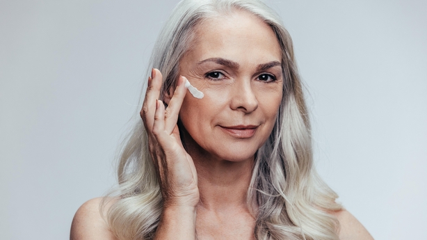 woman applying moisturiser