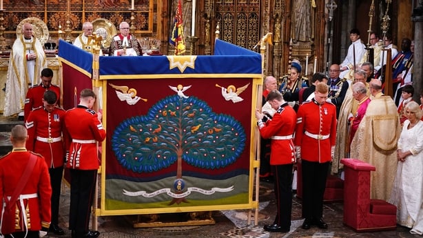 King Charles shielded by the screen during the ceremony