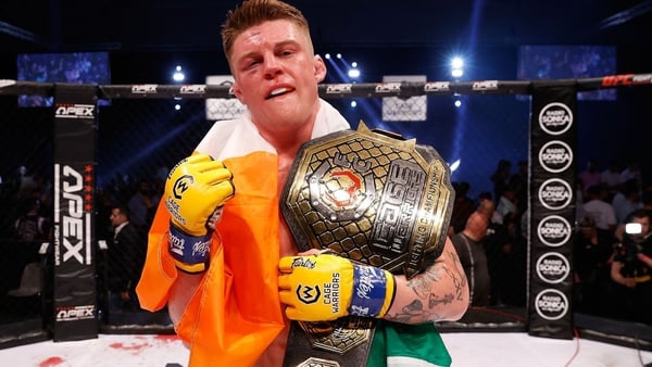 Loughran got his hands on the belt. Image by Dolly Clew/Cage Warriors
