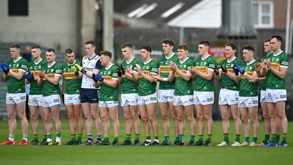 The Kerry team stand during a round of applause in honour of the late Ellen Clifford