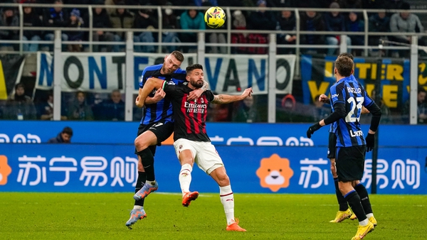 AC Milan's Olivier Giroud and Inter Milan defender Milan Skriniar battle for the ball in February