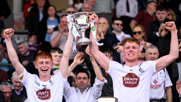 Kildare joint captains Harry O'Neill, left, and Shane Farrell lift the trophy