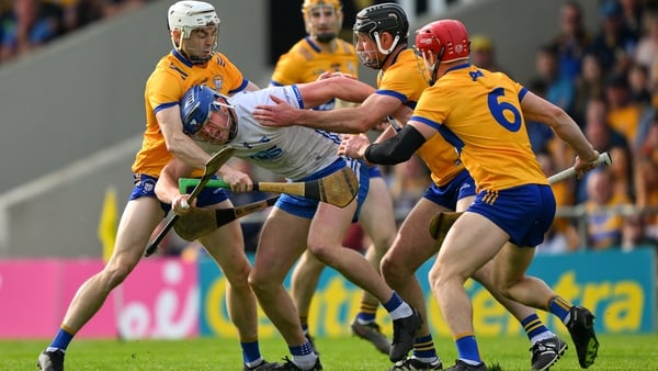 Jamie Barron of Waterford is tackled by Cathal Malone, Ryan Taylor and John Conlon of Clare