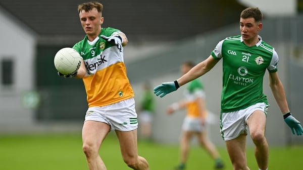 Jack McEvoy of Offaly in action against Joseph McGill of London