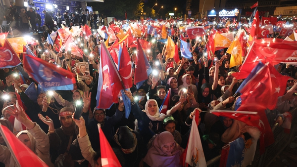 Supporters of Turkish President Recep Tayyip Erdogan celebrate at the AK Party headquarters