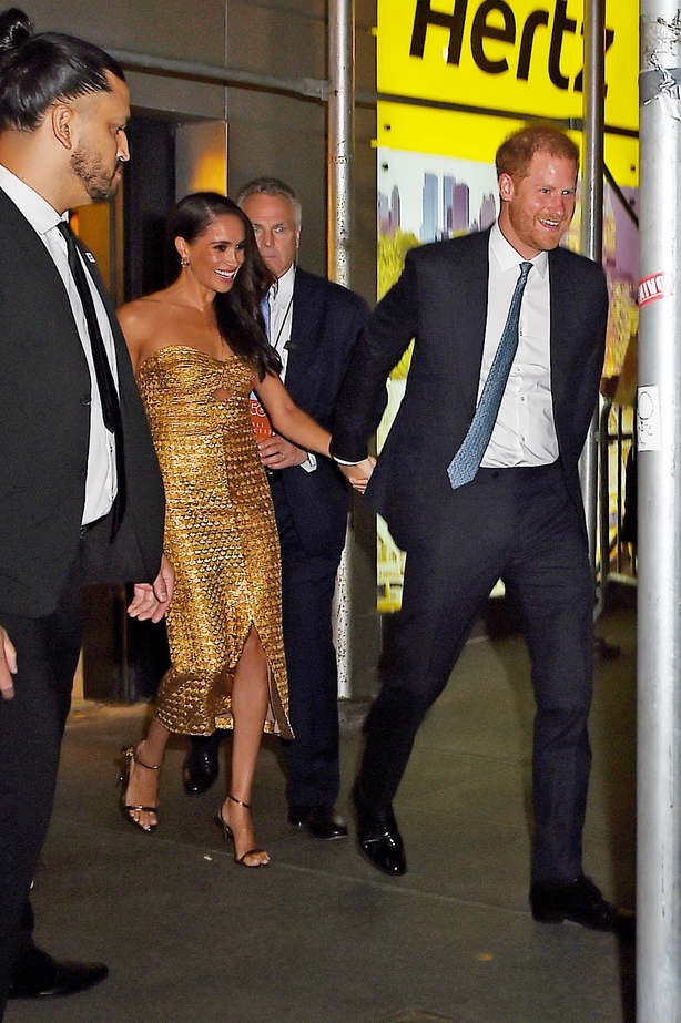 Meghan Markle Looks Radiant In Gold Gown At NYC Award Show