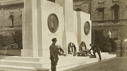 John McCormack laying a wreath at the memorial to Collins and Griffith. Image courtesy of the National Library of Ireland
