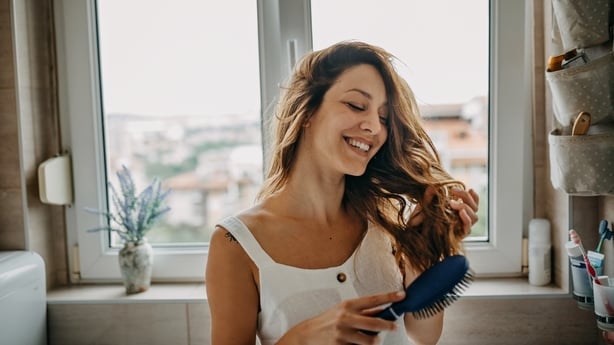 woman brushing hair