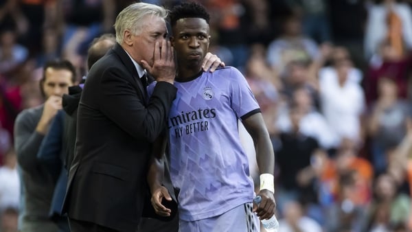 Carlo Ancelotti speaks to Vinicius Jr during Real Madrid's clash against Valencia on Sunday