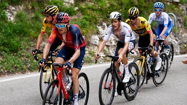 Eddie Dunbar (in blue and white) stayed with race leader Geraint Thomas and main contenders on today's punishing stage