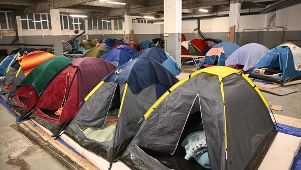 A camp for people who are homeless in a car park near the Arc de Triomphe in Paris