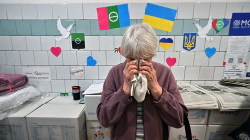 A displaced Bakhmut resident cries as she visits a support center in Kyiv this week