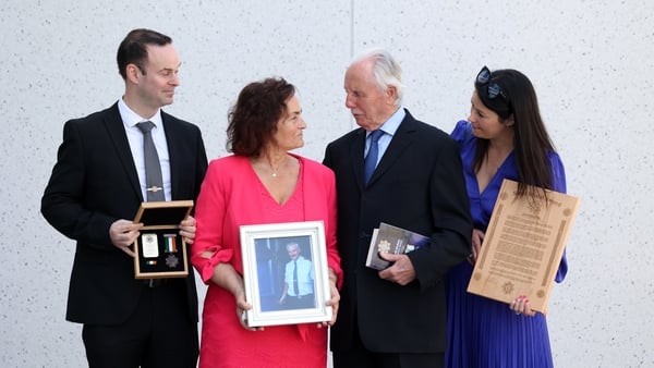 Sgt Daniel Kellehers family (LtoR), Daniel (Son), mother Caroline, and daughter Lesslie with the Bronze Scott Medal (Posthumously) to Sgt Daniel Kelleher with (2nd centre) Mr Don Tidey (RollingNews.ie)