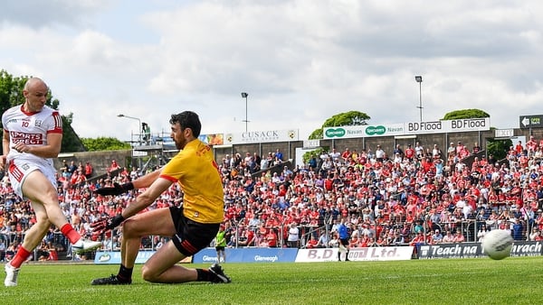 Cork's Brian O'Driscoll shoots past Louth goalkeeper James Califf to score a goal at Pairc Tailteann
