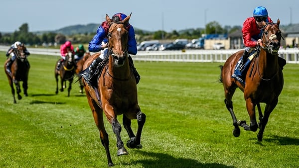 Luxembourg, with Ryan Moore up, left, on their way to winning the Tattersalls Gold Cup