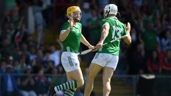 Limerick's Seamus Flanagan, left, celebrates with teammate Aaron Gillane, after scoring his first-half goal against Cork