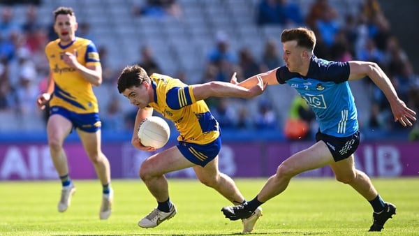Ben O'Carroll of Roscommon in action against Daire Newcombe of Dublin