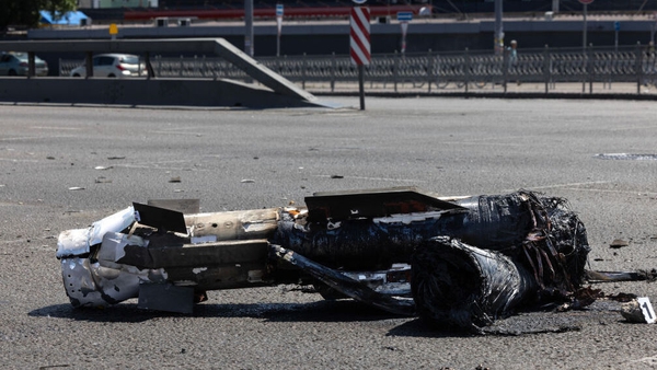 Debris on a road in Kyiv after the city came under attack today