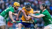 Cathal Malone of Clare bursts through Tom Morrissey (L) and Peter Casey of Limerick at the TUS Gaelic Grounds in April