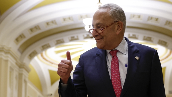 US Senate Majority Leader Chuck Schumer gives a thumbs up as he walks to a press conference after final passage of the Fiscal Responsibility Act