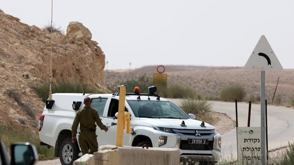 An Israeli soldier approaches a vehicle near the southern border with Egypt
