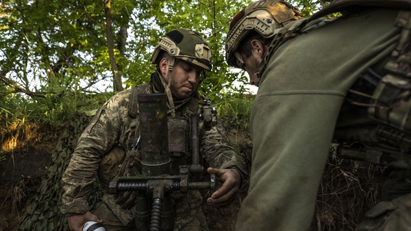 Ukrainian soldiers prepare to open fire on Russian positions on the frontline towards the city of Avdiivka, Donetsk Oblast